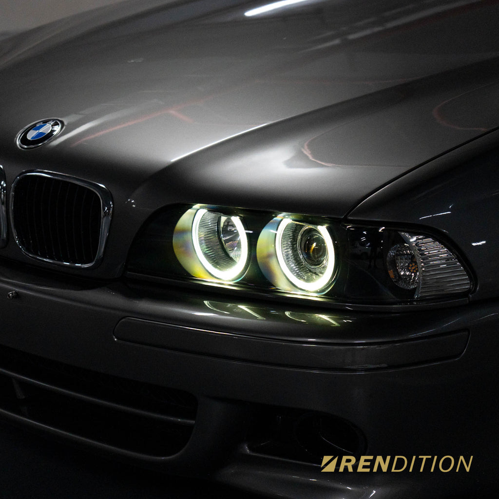 BMW E39 LED projector headlights with white halo rings and sharp beam pattern