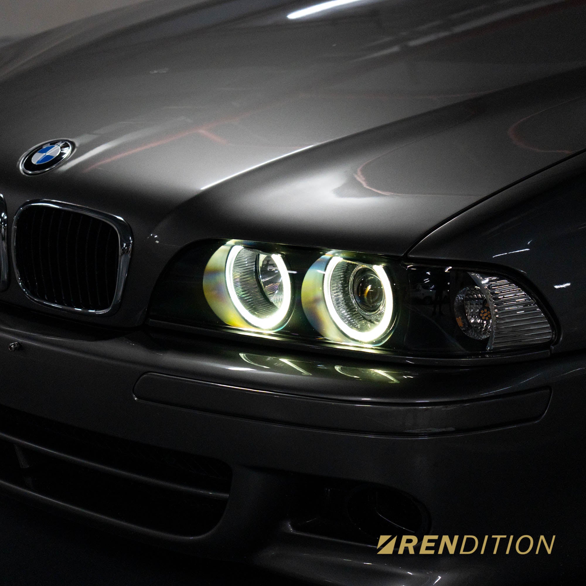 BMW E39 LED projector headlights with white halo rings and sharp beam pattern