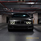 BMW E39 LED projector headlights with white halo rings and sharp beam pattern