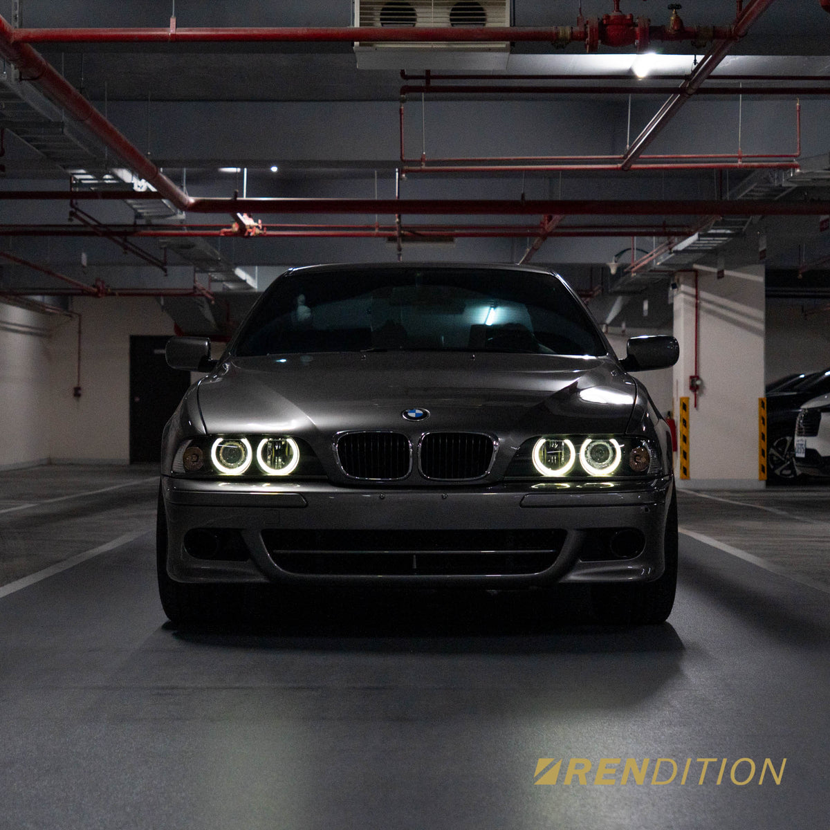 BMW E39 LED projector headlights with white halo rings and sharp beam pattern