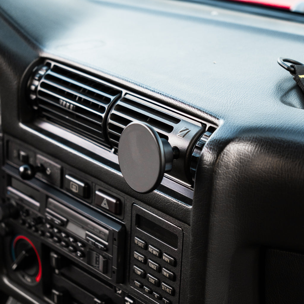 BMW E30 center vent phone mount with MagSafe holder installed