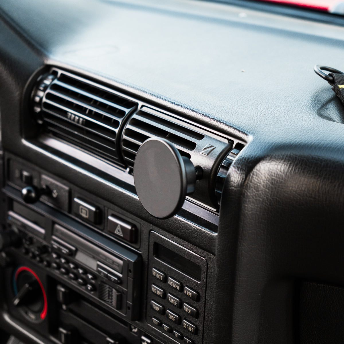 BMW E30 center vent phone mount with MagSafe holder installed