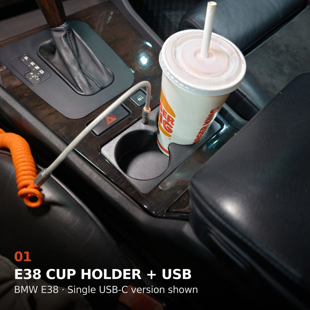 BMW E38 front cup holder in use, with the single USB-C charging option shown
