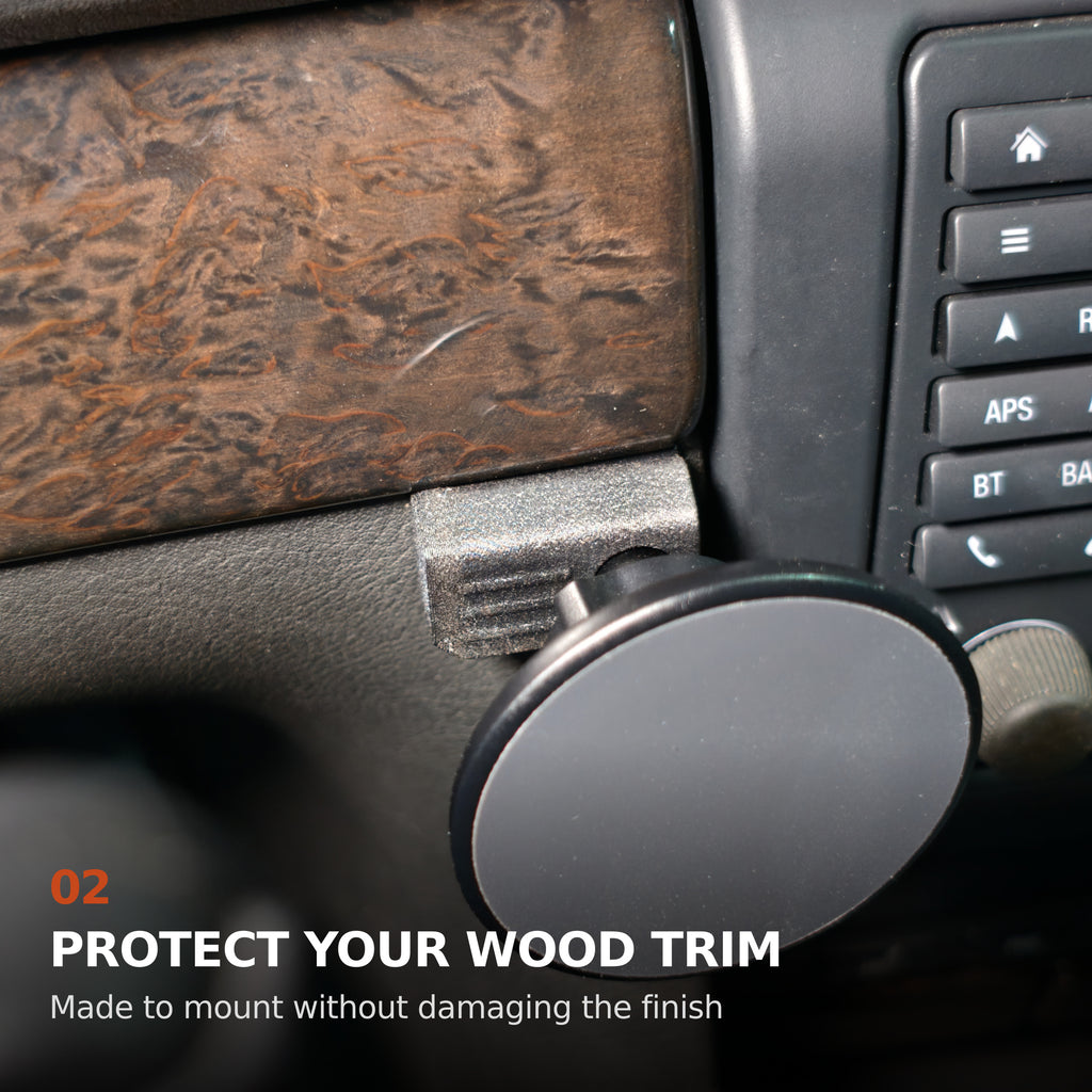 Close-up of the BMW E38 ABS-GF mounting bracket below the wood trim, designed to protect the original finish.
