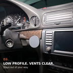 Low-profile BMW E38 phone mount beside the center display with the main air vents clear.
