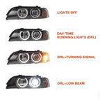 BMW E39 LED projector headlights with white halo rings and sharp beam pattern