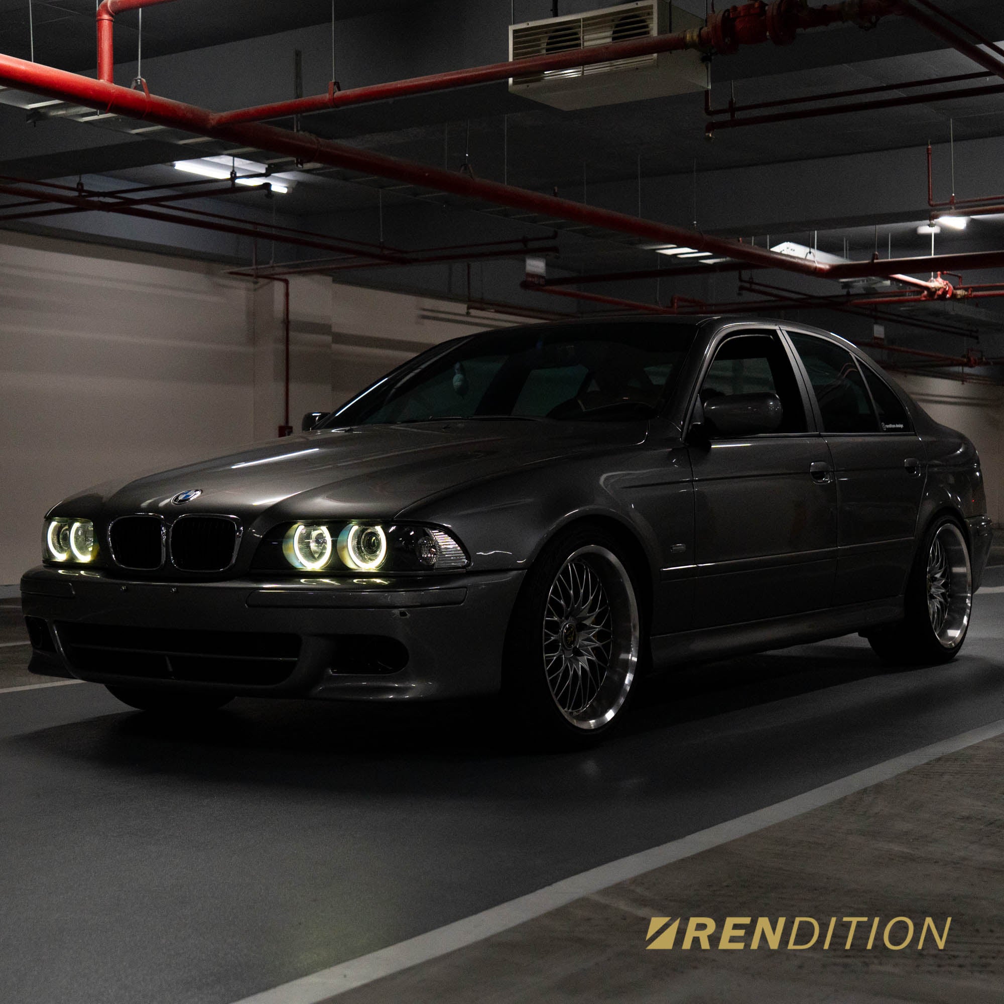 BMW E39 LED projector headlights with white halo rings and sharp beam pattern