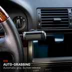 BMW E39 auto-grabbing phone holder installed beside the factory dashboard trim and center air vents.