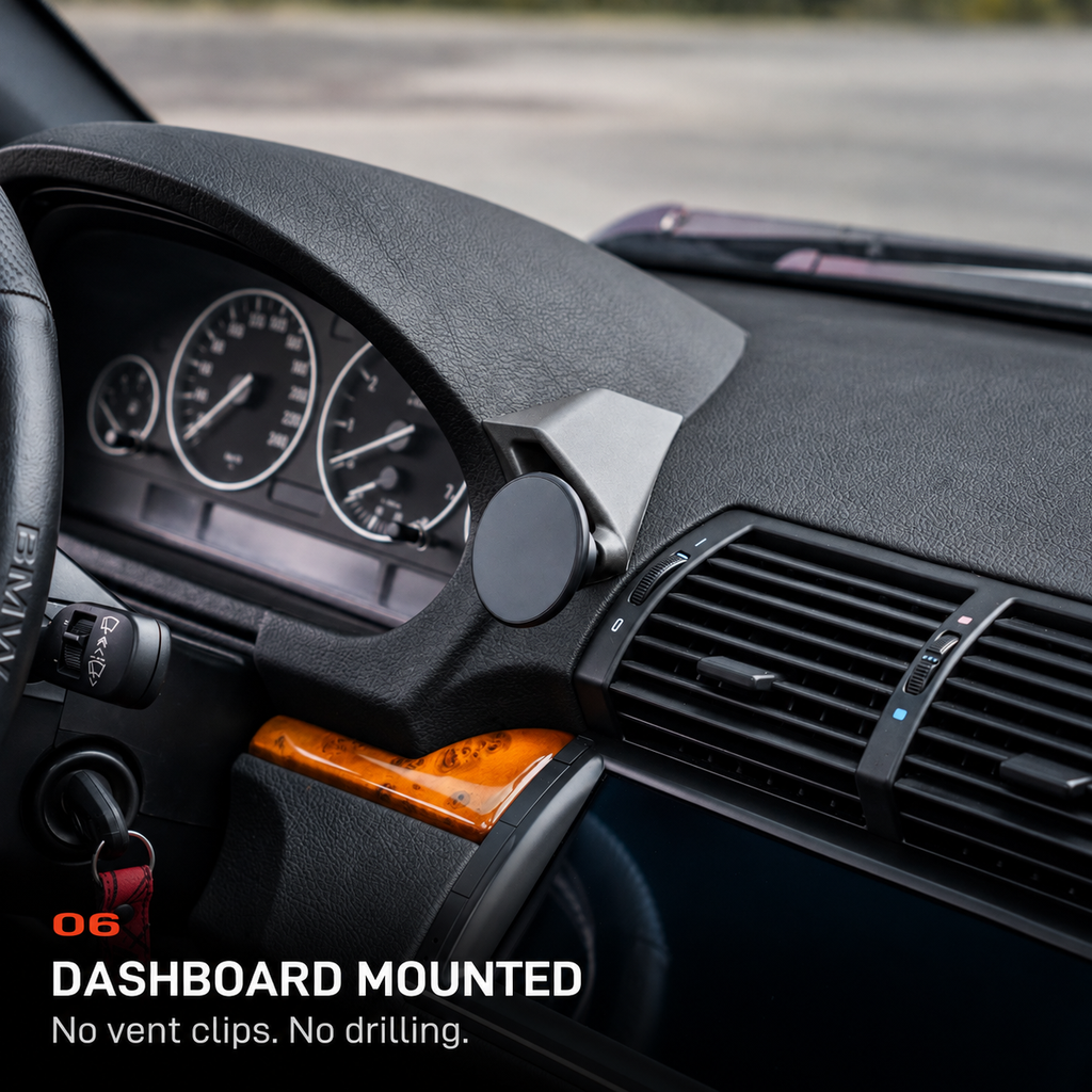BMW E53 X5 phone mount installed on the dashboard beside the air vents without vent clips or drilling.